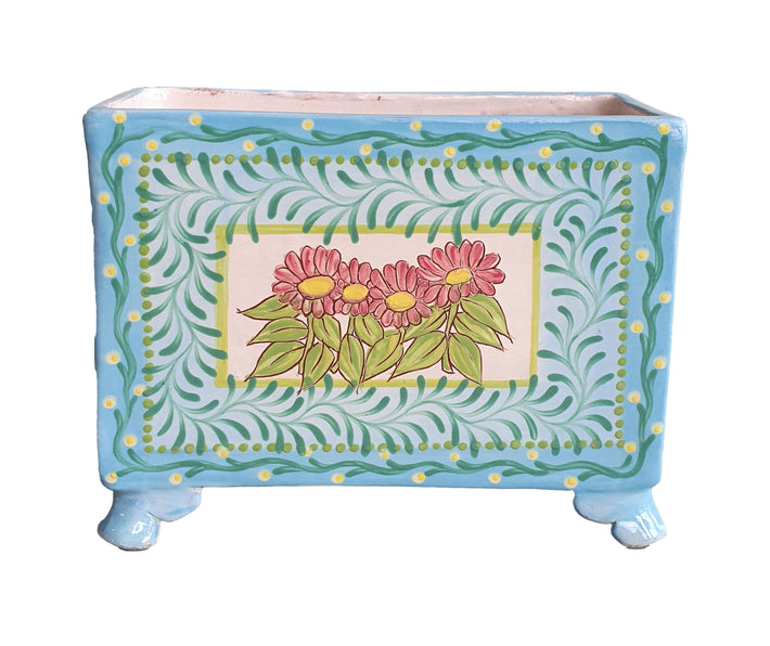 Katrin Moye's Flower Box, has a simple pastel daisy motif at its heart, surrounded in pale aqua, and is a delightful and unusual way to display spring flowers 