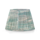 Textured lampshade with a ribbed pattern on a white background