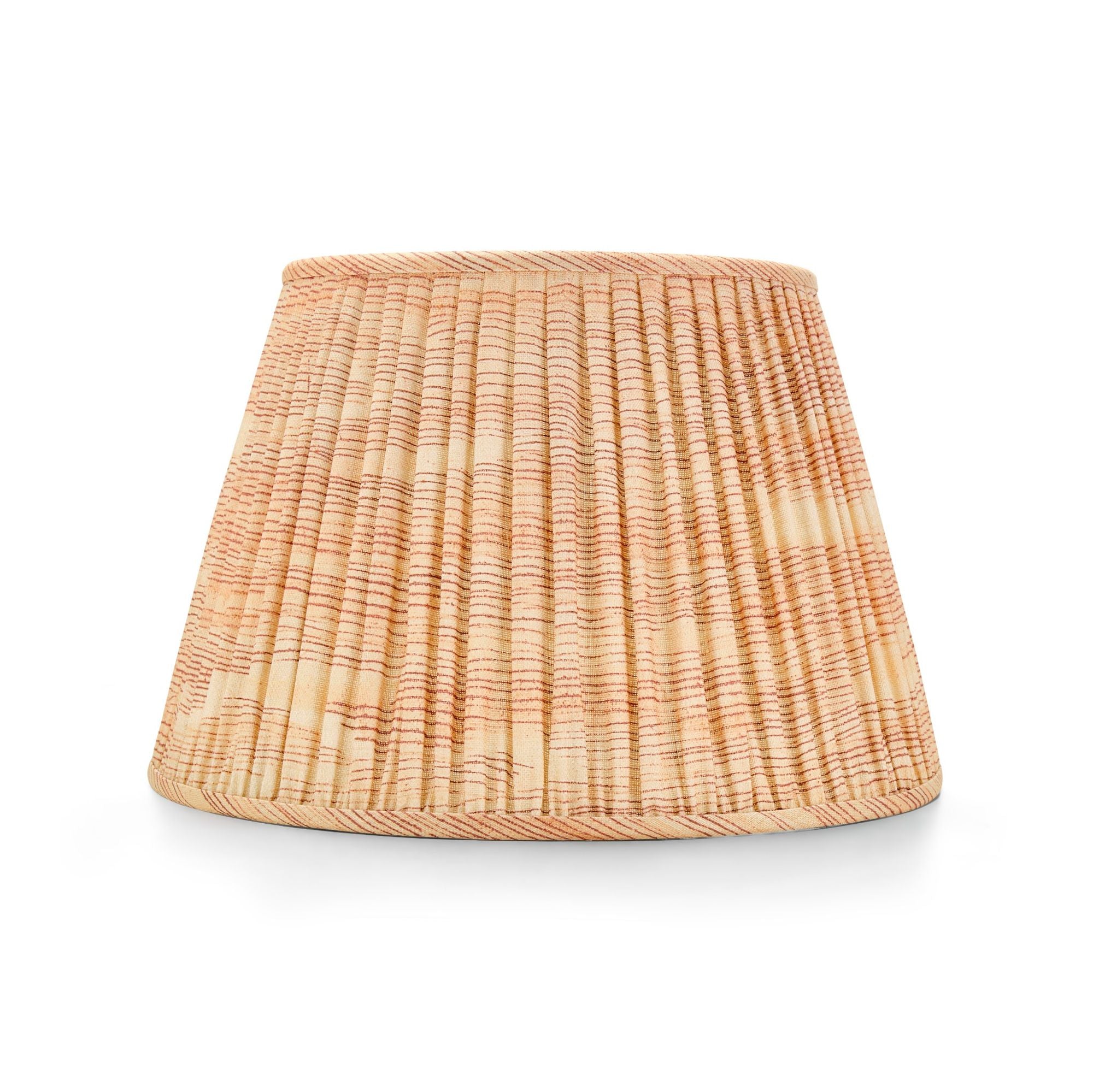 Rust pleated lampshade in textured fabric with subtle stripe pattern in warm neutral tones