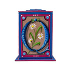 This blue and cerise alphabet box is decorated with a blue letter Q in a heraldic decorative style, with a white daisy motif and embellished with a blue and green jewelled lid. 