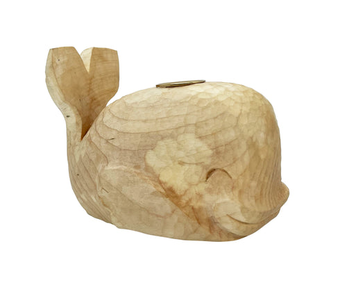 This hand carved sycamore whale candlestick is viewed facing the right.