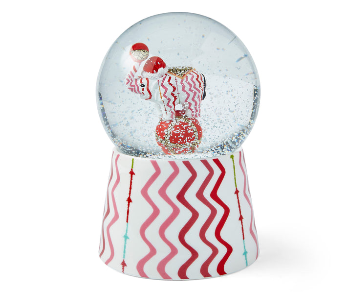 The Rick Rack Snow globe, which combines one of Kit Kemp's signature fabric designs, in bright pinks and red zig zag stripes with Jambo, our patchwork elephant to make this Christmas collectable.