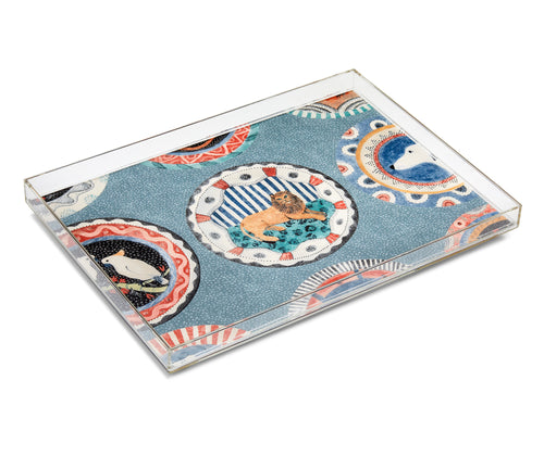 The Robina Tray, encases Kit's fun homage to the ceramics of Robina Jack's in acrylic to add a touch of humour to you coffee table, this re-imagining of the traditional tea tray, with its whimsical animal portraits, surrounded by colourful patterns, and a dusky blue background.