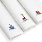 3 Sailor's Farewell linen napkins in the different embroidered designs.