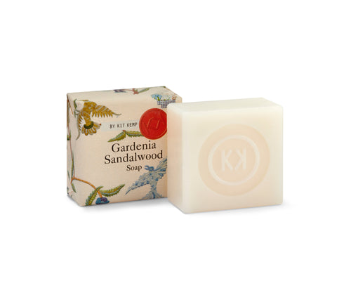 2, 50g gardenia soaps, shown , on wrapped in the cream mythical creatures printed paper , with one displayed outside of wrapping showing the natural soap bar embossed with the Kit Kemp logo.