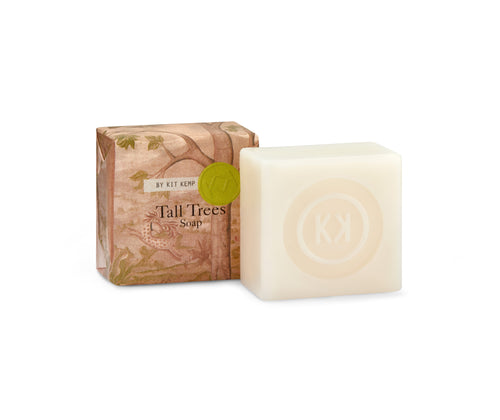 2, 50g tall trees soaps, shown , on wrapped in the pale pink tall trees printed paper, with one shown outside of wrapping showing the natural soap bar embossed with the Kit Kemp logo.