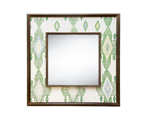 The Travelling Light Mirror, features Kit Kemp's fabric designed for Christopher Farr , in white linen, and draws its design inspiration from traditional kilim designs, in shades of fresh greens and blues, stretched to form a wide decorative border around a square central mirror, in a wooden frame, to stunning effect.