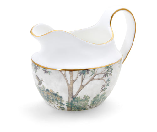 Kit Kemp's Tall Trees Creamer, takes its inspiration from the Spode archive, with is curvaceous lines and sculpted form it makes for a refined addition to your tea service. This Cream Jug is enveloped in the soft natural tones of the Tall trees design, contrasting with the elegant white of the bone china , and trimmed in gold this truly is a stand out piece to admire. Size: 10 oz