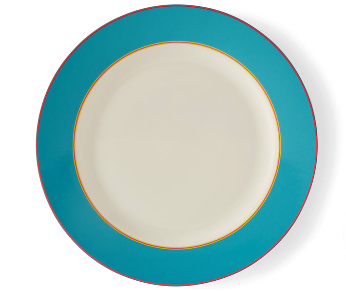 The Turquoise Calypso Charger Plate, is a large 33cm white plate, with a wide turquoise blue band, bordered by narrow central stripes in pink and yellow, and tipped with a pink outer band. Sold in sets of 4, these plates bring joy and sunshine to your table settings.