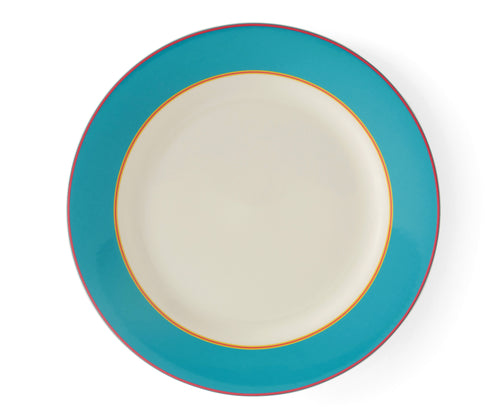 The Turquoise Calypso Dinner plate, is a large 27cm white plate, with a wide turquoise blue band, bordered by narrow central stripes in pink and yellow, and tipped with a pink outer band. Sold in sets of 4, these plates bring joy and sunshine to your table settings.