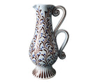 The Upright Double Handle Baluster Jug , by Katrin Moye is hand thrown, pale wedgewood blue jug, hand painted with blue berried plant life, and is a beautifully practical addition to any dining table.