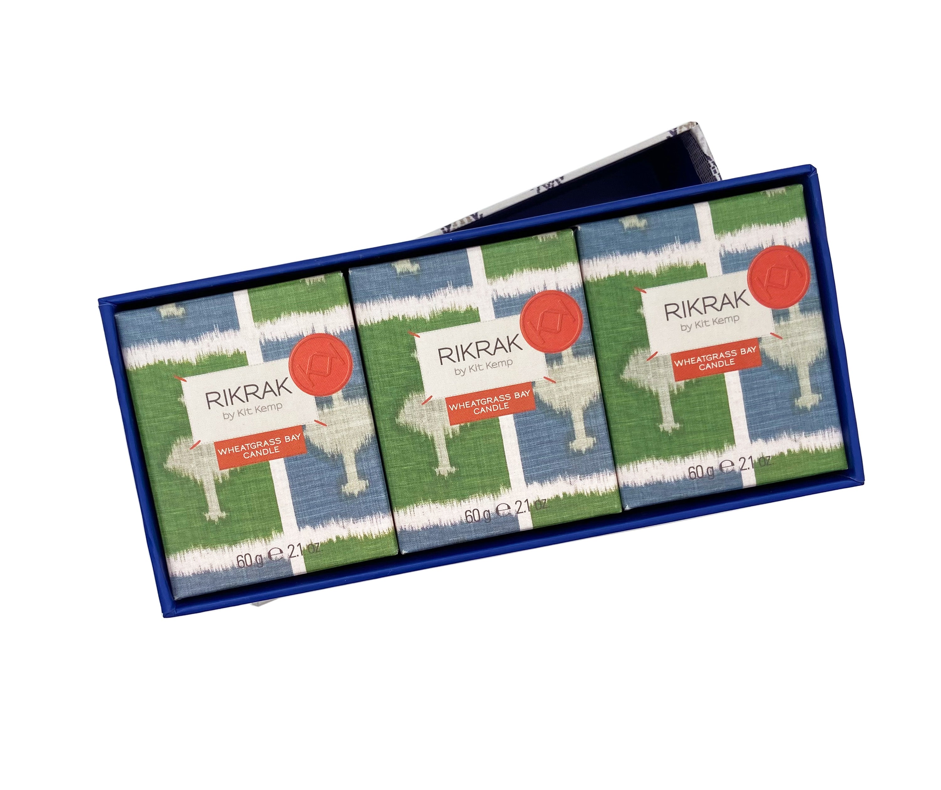 View of 3 of the blue and white candle boxes, with the blue and green chequer board with off white cloud like design of the Ozone cloth, a perfect gift for adding fragrance in three locations with this 60g candles set.