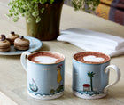 2 sailors mugs on a table with hot chocolate