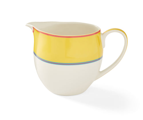 The Calypso Yellow Cream Jug has a elegant curvaceous shape and is topped with a wide Yellow band, bordered by narrow stripes in pink and blue, and adds a touch of colour to your breakfast table.